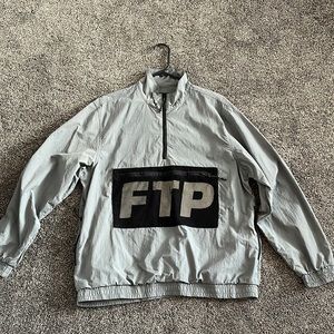 Ftp mesh windbreaker, zipper pockets on side and front. Used once.